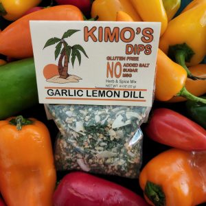 Kimo's Dips Garlic Lemon Dill mix in package on a field of peppers