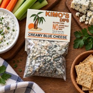 Package of Kimo's Creamy Blue mix among various crackers and vegetables