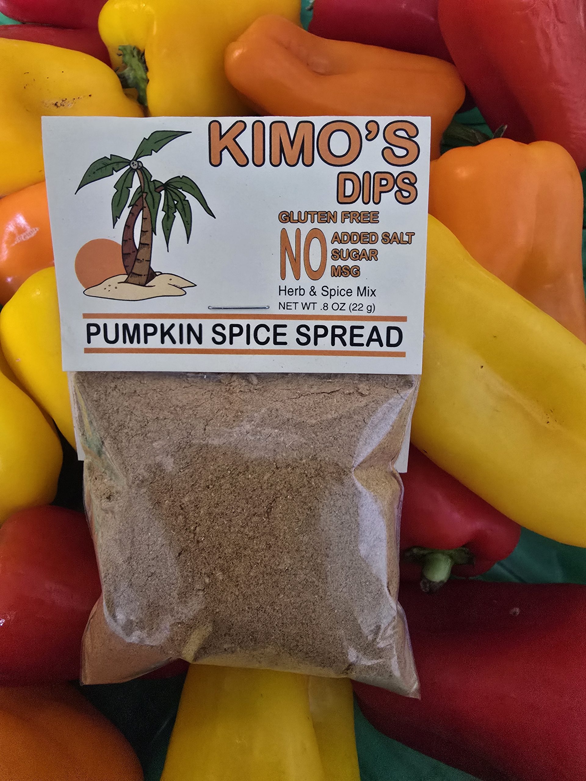 Package of Kimo's Pumpkin Spice Spread on a colorful background of various peppers